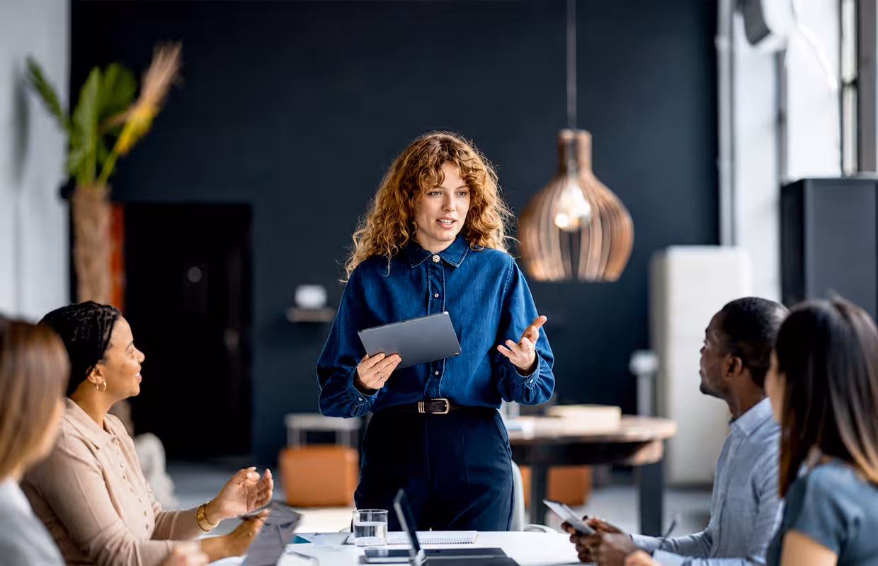 Finance professionals reviewing business documents together