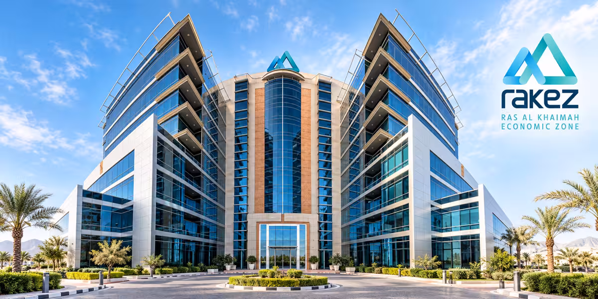 Modern glass-fronted building with RAKEZ branding and landscaped grounds in Ras Al Khaimah