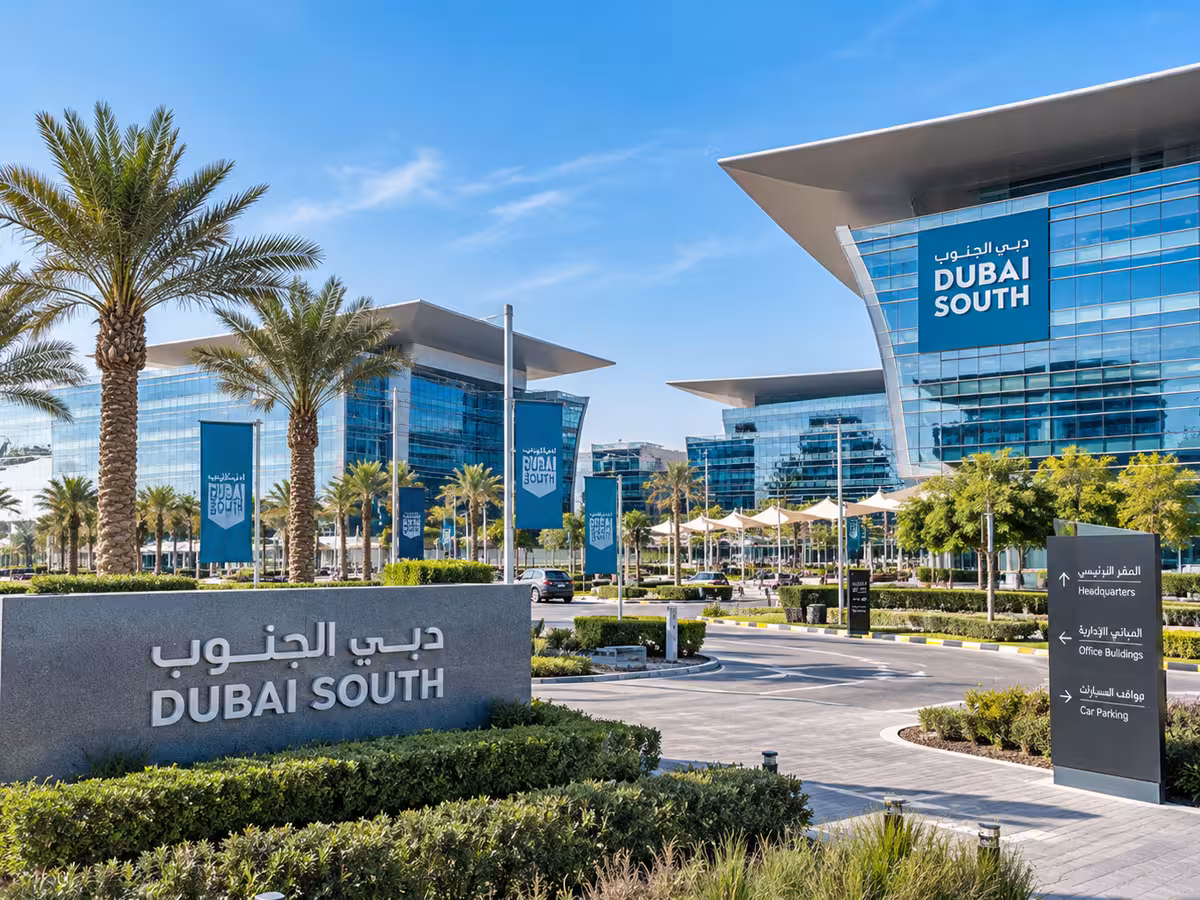 Dubai South office buildings and landscaped entrance with palm trees